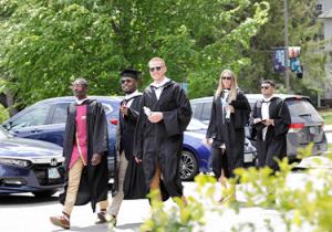 Students walking in regalia