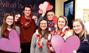 Dan Forbes at the Meelia Valentine's Day Dance with students Maggie O’Connor ’19, Luke Testa ’19, Nicole Lora ’06, Forbes, Maggie Walker ’17, and Cara Onyski ’19