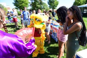 A student in a dragon costume for multicultural day