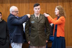 ROTC student receiving his rank