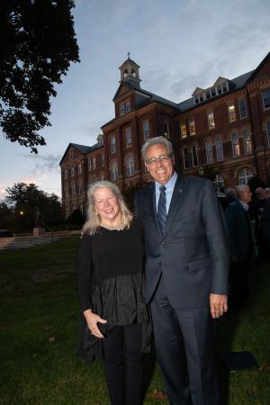 Drs. Joseph and Paddy Favazza standing in front of Alumni Hall