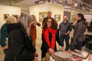 Guest speaker photographer Rania Matar engages an audience member at a Fine Arts Series lecture and book signing at the Chapel Art Center in February.