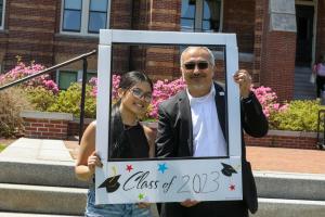 Professor Jaime Orrego with a first-gen student at a celebration on Alumni Quad