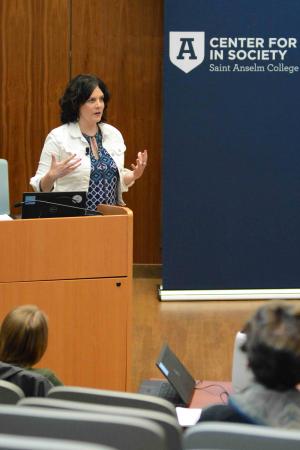 Sarah Guglielmi presenting a discussion on yoga as a way of life.