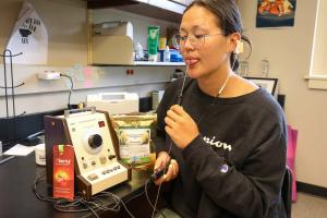 Colleen Chen '23 uses an electrogustometer as she studies taste sensitivity. 
