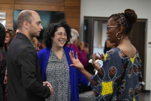 Dr. Thema speaking with Professor Loretta Brady