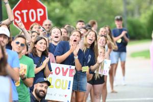 Saint Anselm students cheering walkers upon their return to campus