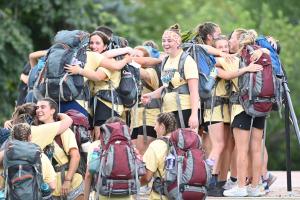 Road for Hope walkers embracing on campus at the end of their walk