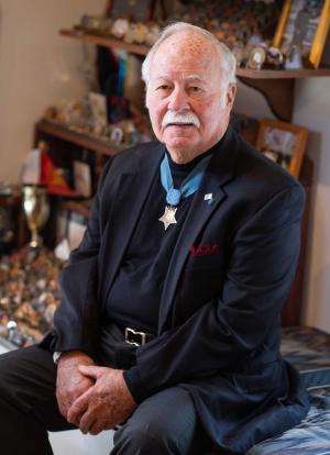 Harvey C. Barnum, Jr. ’62, H.D. ’04, U.S.M.C. (Ret.) in his home