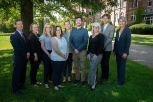 Seven new faculty members with Dean Mark Cronin