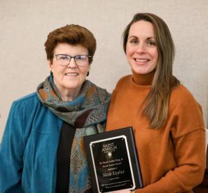 Nicole Kipphut receiving an award at the dinner