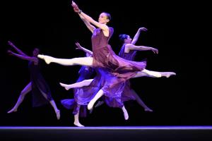 A picture of dancers mid-performance in a variety of positions