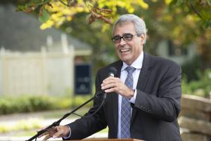 Dr. Favazza speaking at a podium