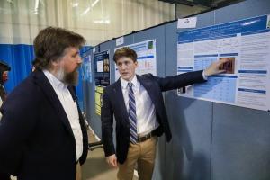Student presenting to a professor at SOAR