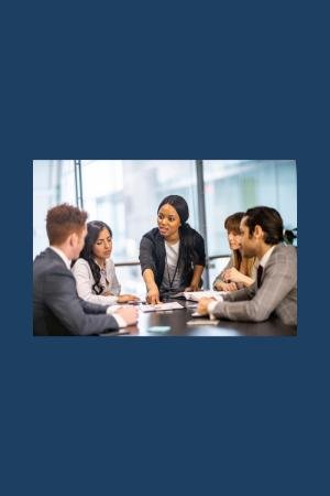 People gathered around a table for a discussion