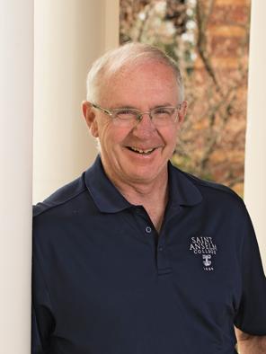 Mike McGuinness '78 poses for a photo in front of Joseph Hall