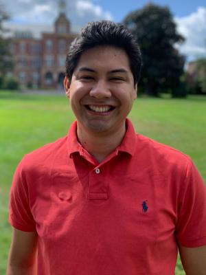 Roque Otazo standing on Alumni Quad