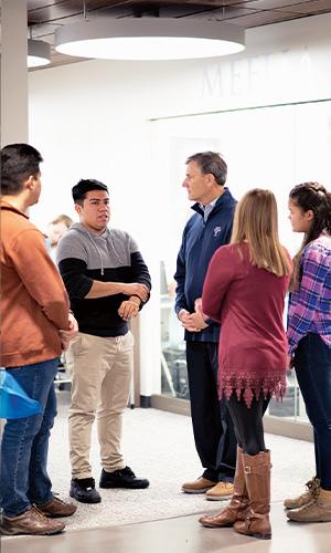 Rich Meelia ’71, H.D. ’14 talks with students. Photo by Kevin Harkins