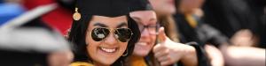 Student smiles at graduation