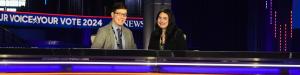 Two students sitting on the set of the ABC Debate