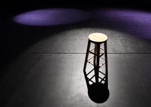spotlight on chair on a theatre stage