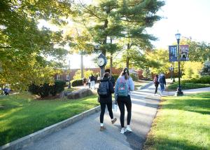 students walk through campus