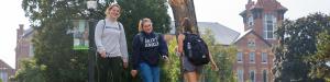 students walking down a campus path