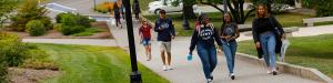 students walking next to the Jean Student Center