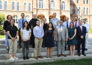 faculty in front of alumni hall 