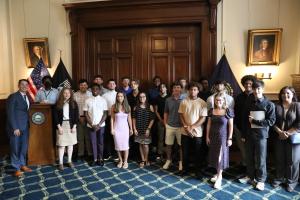 Hilltop Academy students pose for a group photo in the NH State House