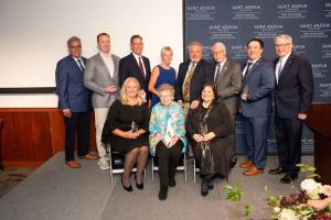 Recipients of alumni awards gathered with President Favazza for a photo