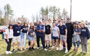 President Favazza with students at a football game.