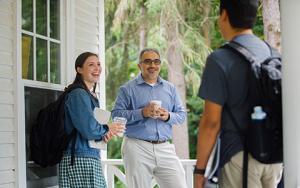 Students speak with a professor