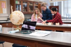 Students studying bones in a lab