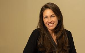 Kaitlyn Clarke '09 sits at a podium