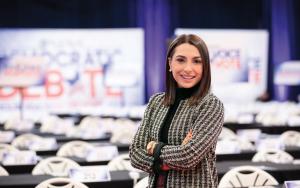 Kelsey Walsh stands in the spin room for the Democratic Debate