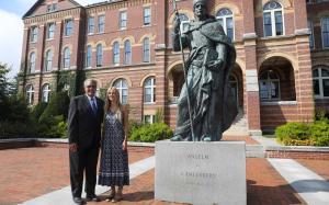 Dr. Favazza and Holmes Scholar Mary Kocev standing next to the statue of St. Benedict