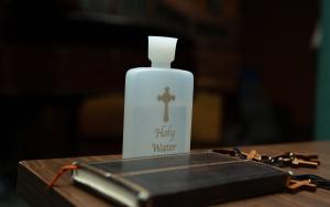 Holy water, bible, and crosses