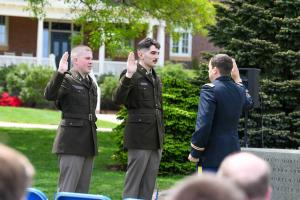 Roughan and Scopa raise their hands to swear their oath of office