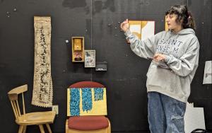 Student presenting artwork in the Fine Arts department
