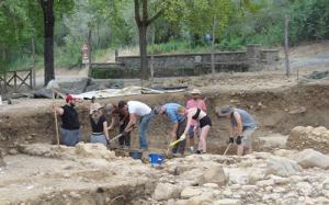 Students working at a dig site