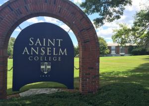 Saint Anselm College sign in front of Poisson Hall