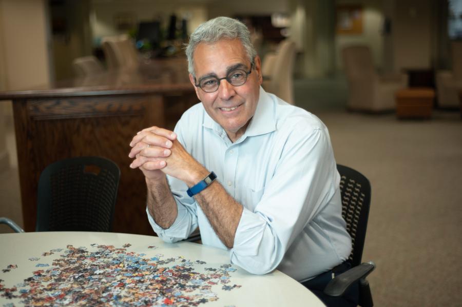 President Favazza working on a puzzle